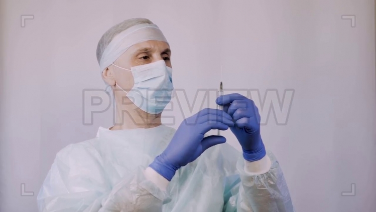 Veterinarian Holding Syringe Stock Video