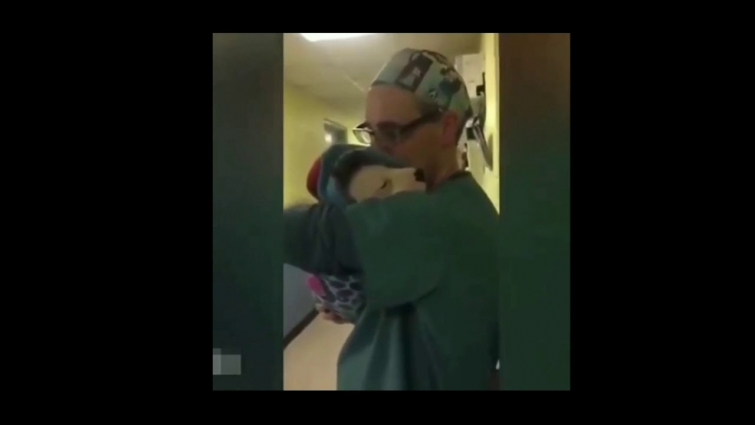 This veterinarian comfort the  dog from the surgery