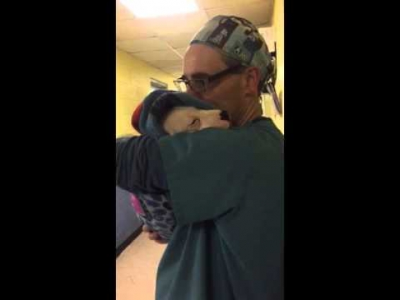 BARCS vet tech comforts crying puppy